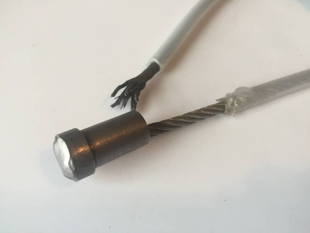 A close up of the weld. Notice how the tube melted from the heat, and the quality of the cable end after it broke during drop testing.
